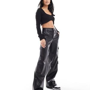 Stradivarius Petite faux leather cargo pants in black